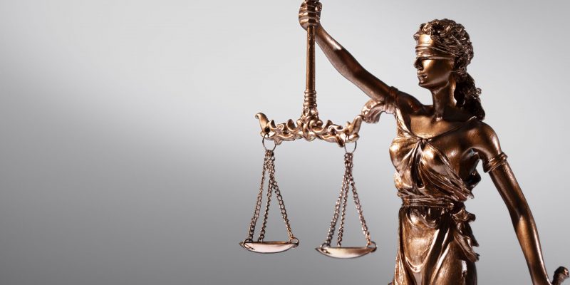 Closeup of lady justice statuette illustrates blog "What Is the Legal Definition of Domestic Violence in California?"